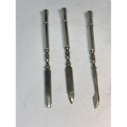 100 - A MARKED STERLING SILVER THREE PIECE MANICURE SET IN A LEATHER AND SILVER CASE