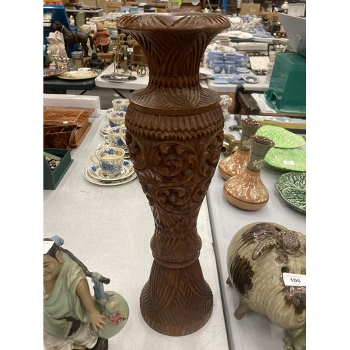 111 - A LARGE HEAVILY CARVED WOODEN VASE, HEIGHT 50CM