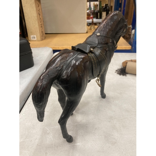 121 - A VINTAGE LEATHER HORSE, HEIGHT 24CM, LENGTH 29CM