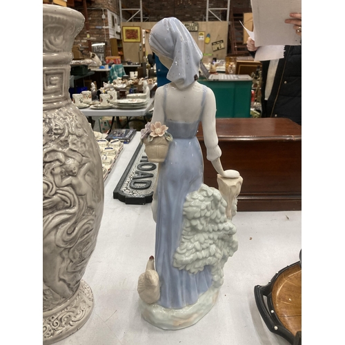 122 - A LARGE CERAMIC FIGURE OF A LADY, HEIGHT APPROX 45CM