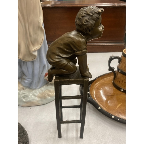 123 - A SIGNED BRONZE CHILD ON A CHAIR, HEIGHT 24CM