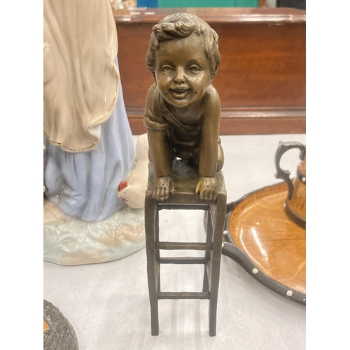 123 - A SIGNED BRONZE CHILD ON A CHAIR, HEIGHT 24CM