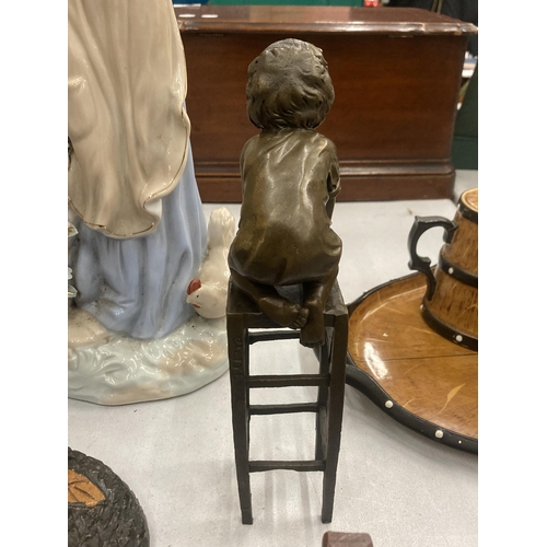 123 - A SIGNED BRONZE CHILD ON A CHAIR, HEIGHT 24CM