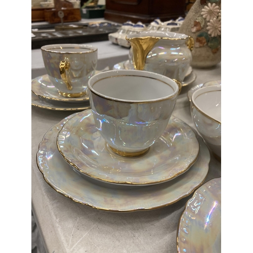 138 - AN EIGHTEEN PIECE CZECHOSLOVAKIAN PEARLESCENT WITH GOLD TRIM PART TEASET TOGETHER WITH A ROYAL WINTO... 