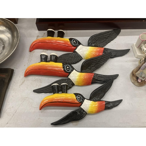 240 - A FLIGHT OF RESIN TOUCANS