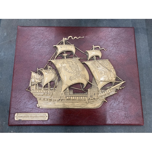 249 - A VINTAGE EMBOSSED SPANISH GALLEON ON RED MOROCCO LEATHER, 30CM X 24CM