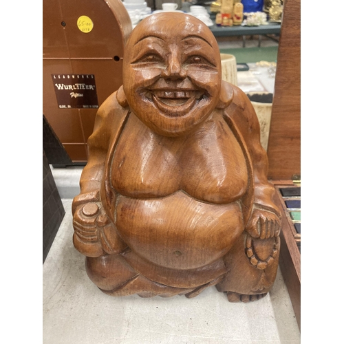 266 - A LARGE WOODEN HAND CARVED BUDDHA