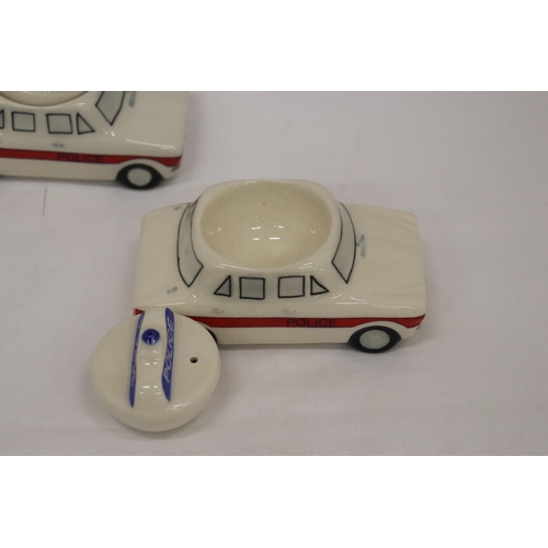 139 - THIRTEEN POLICE CAR EGG CUPS WITH SALT POT FOR LID