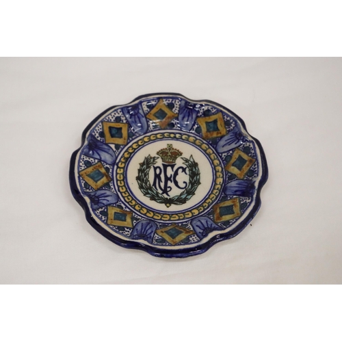 142 - A VINTAGE CONTINENTAL SMALL PLATE WITH THE LOGO FOR THE ROYAL FLYING CORPS