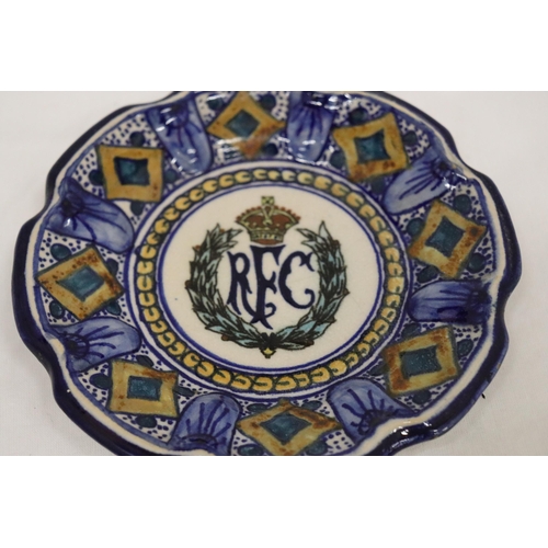 142 - A VINTAGE CONTINENTAL SMALL PLATE WITH THE LOGO FOR THE ROYAL FLYING CORPS