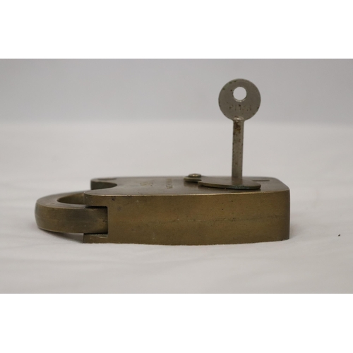 143 - A VINTAGE BRASS UNION PADDLOCK AND KEY - 5 INCH TALL