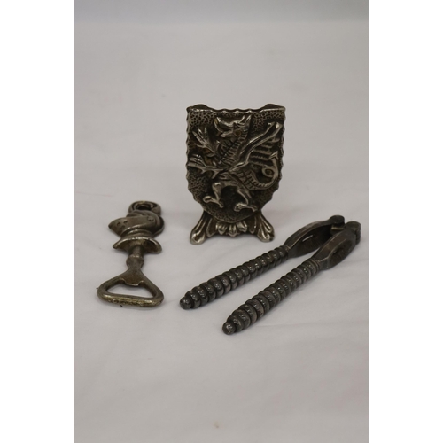 147 - A GRYPHON DOOR STOP TOGETHER WITH A KNIGHT BOTTLE OPENER AND VICTORIAN NUT CRACKER