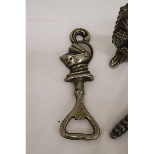 147 - A GRYPHON DOOR STOP TOGETHER WITH A KNIGHT BOTTLE OPENER AND VICTORIAN NUT CRACKER