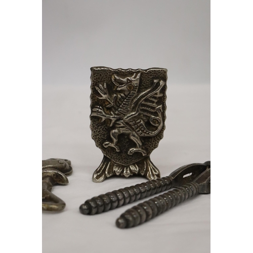 147 - A GRYPHON DOOR STOP TOGETHER WITH A KNIGHT BOTTLE OPENER AND VICTORIAN NUT CRACKER