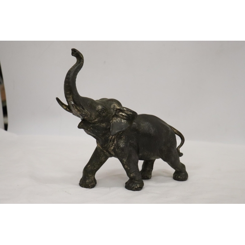 161 - A HEAVY METAL FIGURE OF AN ELEPHANT