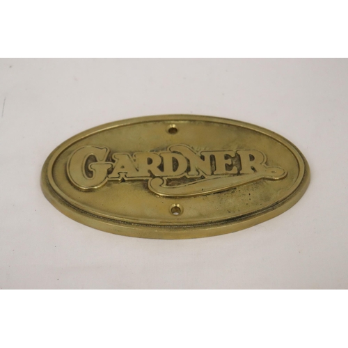 163 - AN OVAL BRASS GARDNER SIGN