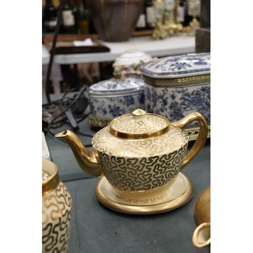 174 - A GILT ROYAL WINTON TEAPOT, CREAM JUG AND SUGAR BOWL, ROYAL WORCESTER WATER JUG, PLUS A PATTERNED TE... 