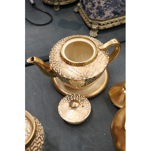 174 - A GILT ROYAL WINTON TEAPOT, CREAM JUG AND SUGAR BOWL, ROYAL WORCESTER WATER JUG, PLUS A PATTERNED TE... 