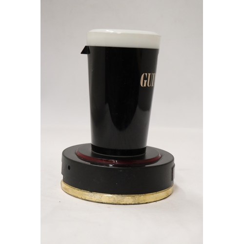 185 - A RARE GUINNESS, LIGHT UP COUNTER SIGN, IN THE FORM OF A PINT GLASS, HEIGHT 18CM