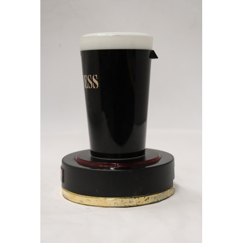 185 - A RARE GUINNESS, LIGHT UP COUNTER SIGN, IN THE FORM OF A PINT GLASS, HEIGHT 18CM