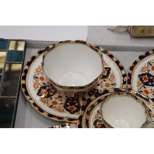 186 - AN ANTIQUE 'COURT CHINA' TEASET TO INCLUDE CAKE PLATES, CUPS, SAUCERS, SIDE PLATES AND A SUGAR BOWL