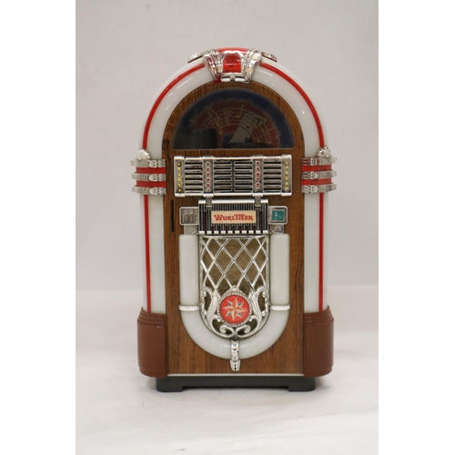 201 - A MINI WURLITZER MICRO CASSETTE PLAYER