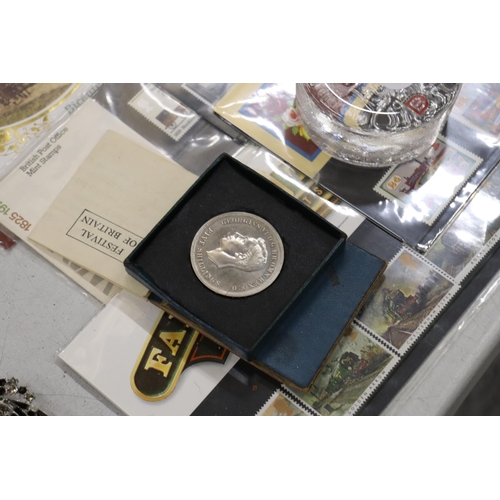 205 - A COLLECTION OF STAMPS, COINS, A PIN AND A PAPERWEIGHT TO INCLUDE 25TH ANNIVERSERY COINS OF QUEEN AN... 