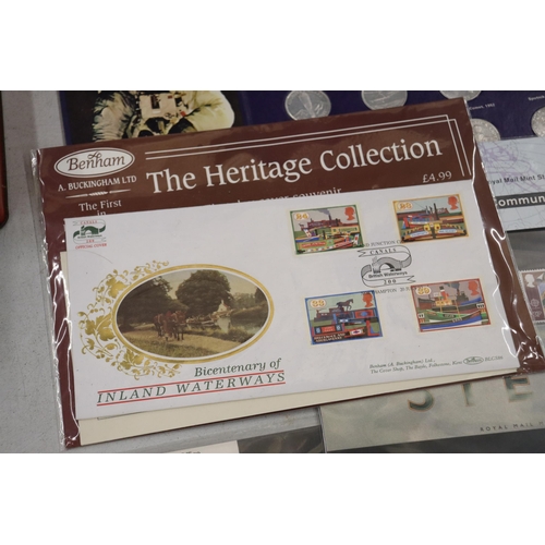 205 - A COLLECTION OF STAMPS, COINS, A PIN AND A PAPERWEIGHT TO INCLUDE 25TH ANNIVERSERY COINS OF QUEEN AN... 