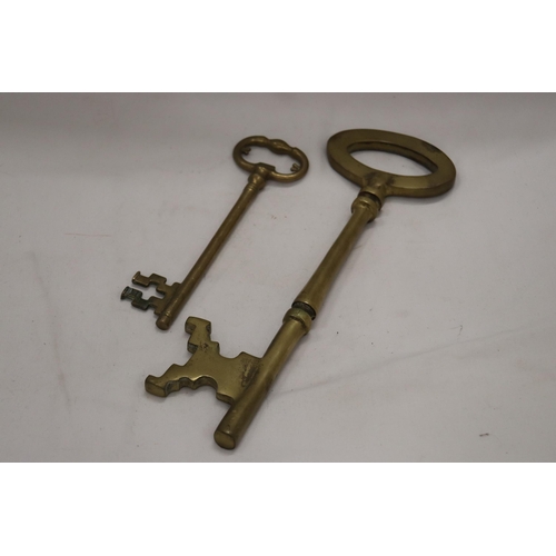 209 - TWO LARGE HEAVY WEIGHT VINTAGE BRASS KEYS - ONE 13 INCHES LONG