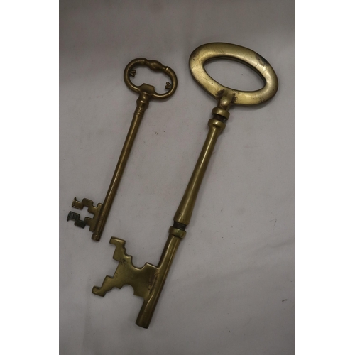 209 - TWO LARGE HEAVY WEIGHT VINTAGE BRASS KEYS - ONE 13 INCHES LONG