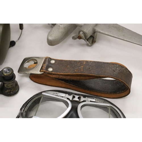 214 - FIVE VINTAGE WAR ITEMS TO INCLUDE PILOT GOGGLES, HEADPHONES, PLANE, BELT AND BINOCULARS