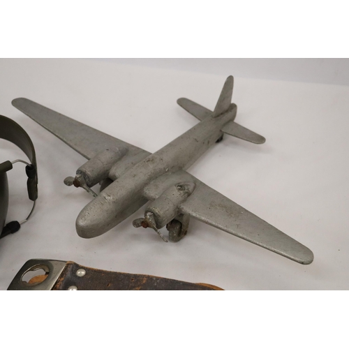 214 - FIVE VINTAGE WAR ITEMS TO INCLUDE PILOT GOGGLES, HEADPHONES, PLANE, BELT AND BINOCULARS