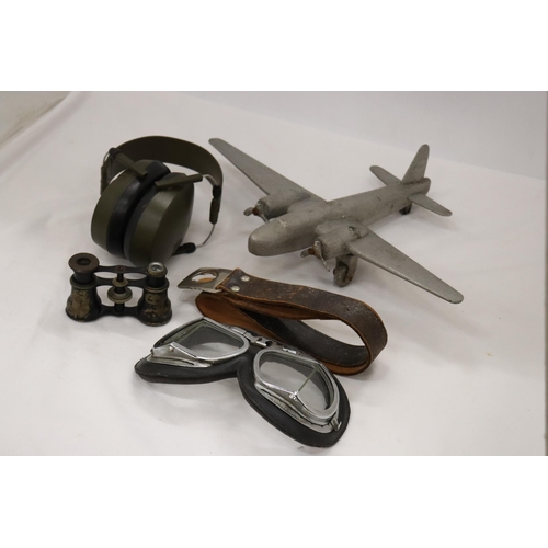 214 - FIVE VINTAGE WAR ITEMS TO INCLUDE PILOT GOGGLES, HEADPHONES, PLANE, BELT AND BINOCULARS