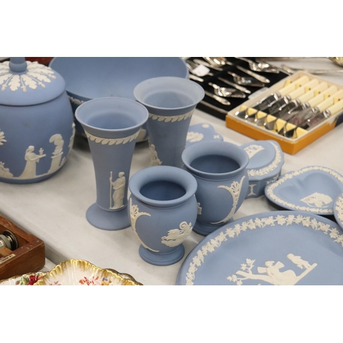 219 - A COLLECTION OF JASPERWARE BLUE AND WHITE WEDGWOOD TO INCLUDE A BISCUIT BARREL, VASES, TINKET BOXES,... 