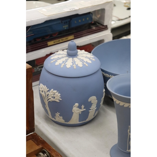 219 - A COLLECTION OF JASPERWARE BLUE AND WHITE WEDGWOOD TO INCLUDE A BISCUIT BARREL, VASES, TINKET BOXES,... 