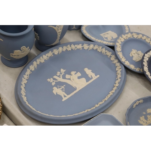 219 - A COLLECTION OF JASPERWARE BLUE AND WHITE WEDGWOOD TO INCLUDE A BISCUIT BARREL, VASES, TINKET BOXES,... 