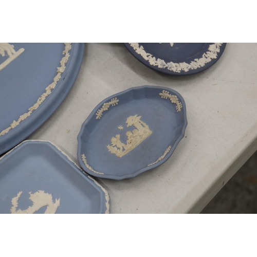 219 - A COLLECTION OF JASPERWARE BLUE AND WHITE WEDGWOOD TO INCLUDE A BISCUIT BARREL, VASES, TINKET BOXES,... 