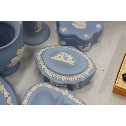 219 - A COLLECTION OF JASPERWARE BLUE AND WHITE WEDGWOOD TO INCLUDE A BISCUIT BARREL, VASES, TINKET BOXES,... 