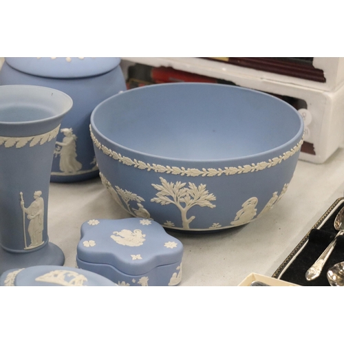 219 - A COLLECTION OF JASPERWARE BLUE AND WHITE WEDGWOOD TO INCLUDE A BISCUIT BARREL, VASES, TINKET BOXES,... 