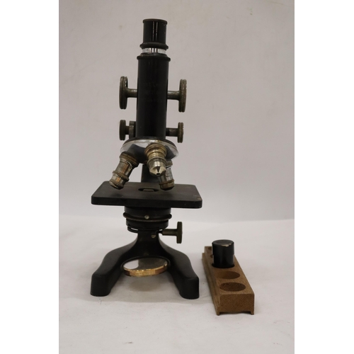 225 - AN ERNST LEITZ WETZLAR MICROSCOPE, NO. 324603, WITH WOOD TRAY AND SPARE LENS