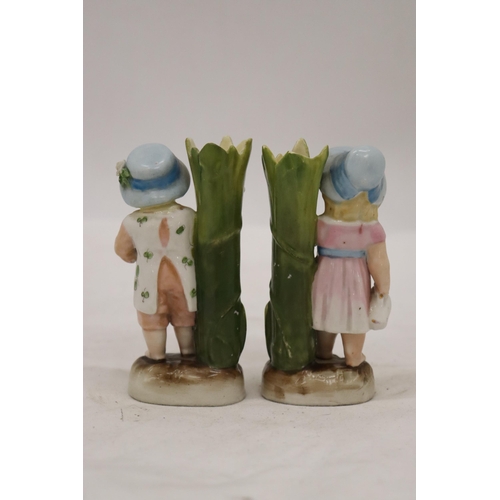 229 - TWO VINTAGE GERMAN CONTA AND BOHME FAIRINGS TO INCLUDE A GIRL WITH JUG VASE AND A GIRL WITH BASKET V... 