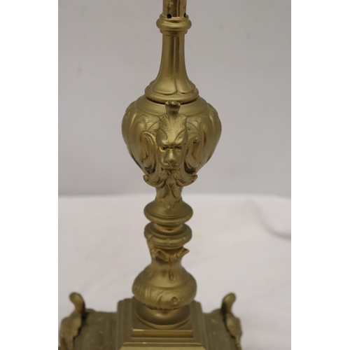 299A - A VINTAGE STYLE HEAVY BRASS CANDLE HOLDER, HEIGHT 55CM