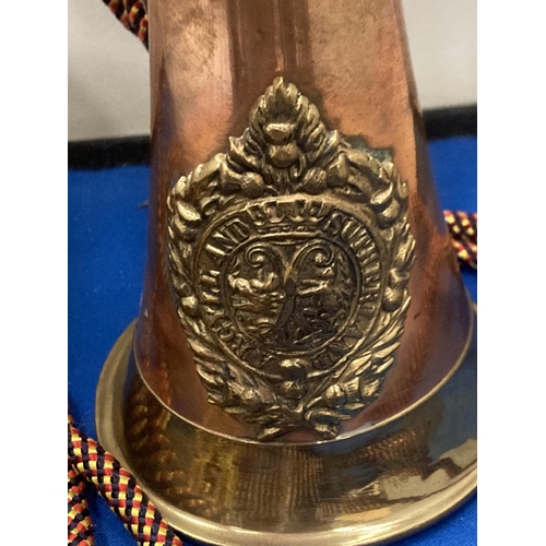 10 - A BRASS AND COPPER 20TH CENTURY BUGLE WITH AN ARGYLE AND SUTHERLAND REGIMENTAL CREST  AND CORD