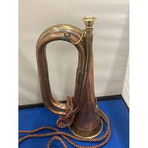 10 - A BRASS AND COPPER 20TH CENTURY BUGLE WITH AN ARGYLE AND SUTHERLAND REGIMENTAL CREST  AND CORD