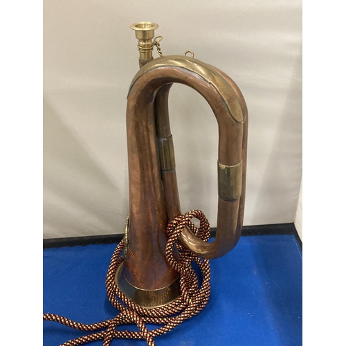 10 - A BRASS AND COPPER 20TH CENTURY BUGLE WITH AN ARGYLE AND SUTHERLAND REGIMENTAL CREST  AND CORD