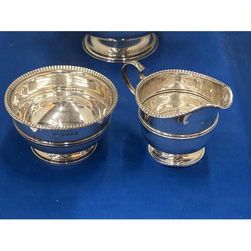 12 - THREE ITEMS TO INCLUDE A HALLMARKED BIRMINGHAM SILVER JUG AND BOWL AND A VINERS OF SHEFFIELD SILVER ... 