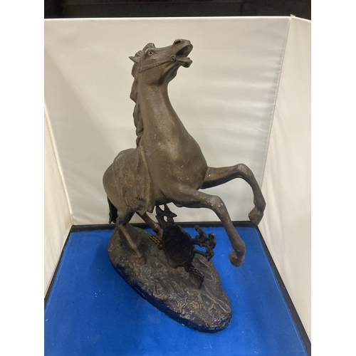 18 - A VINTAGE SPELTRE HORSE REARING OVER A SHEILD