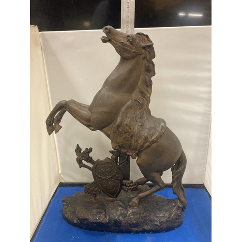 18 - A VINTAGE SPELTRE HORSE REARING OVER A SHEILD