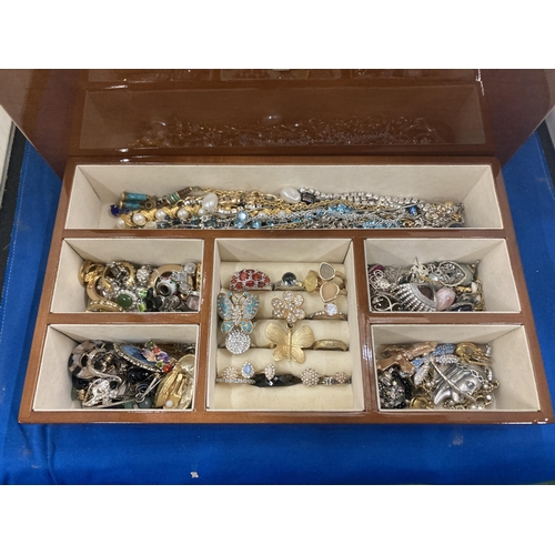 37 - A JEWELLERY BOX WITH LIFT UP MIRROR LID AND  TWO INNER TRAYS