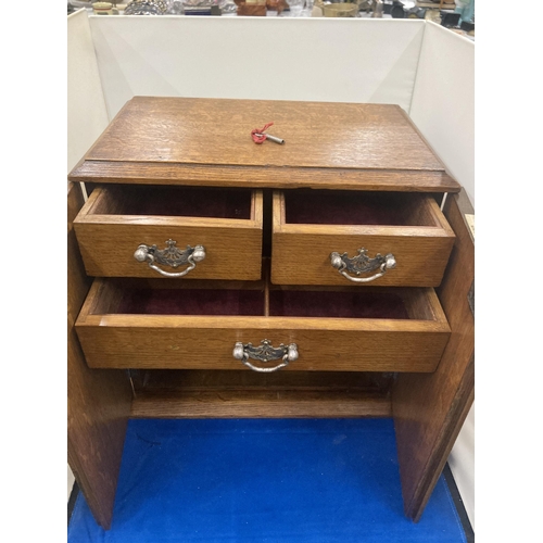 44 - A WEBB AND SON PLYMOUTH EXETER  OAK STATIONARY CABINET WITH THREE INTERIOR DRAWERS ENCLOSED WITH DOU... 